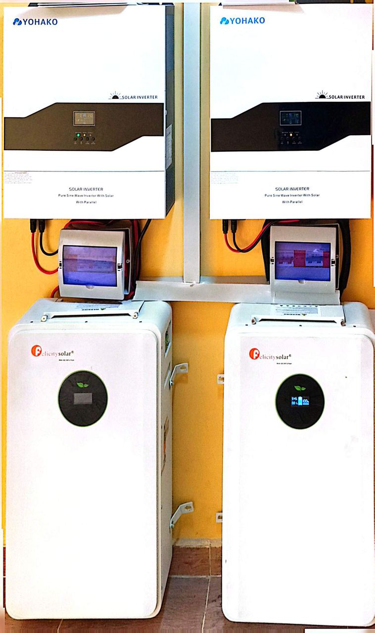 Twin hybrid inverters with battery bank
