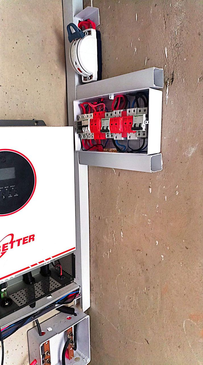 Inverter with open distribution board and breakers