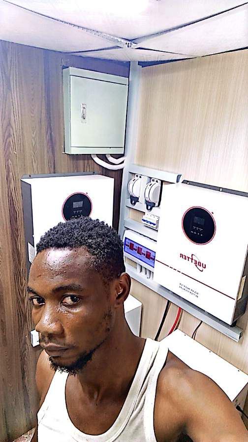 Team member with installed hybrid inverters and batteries