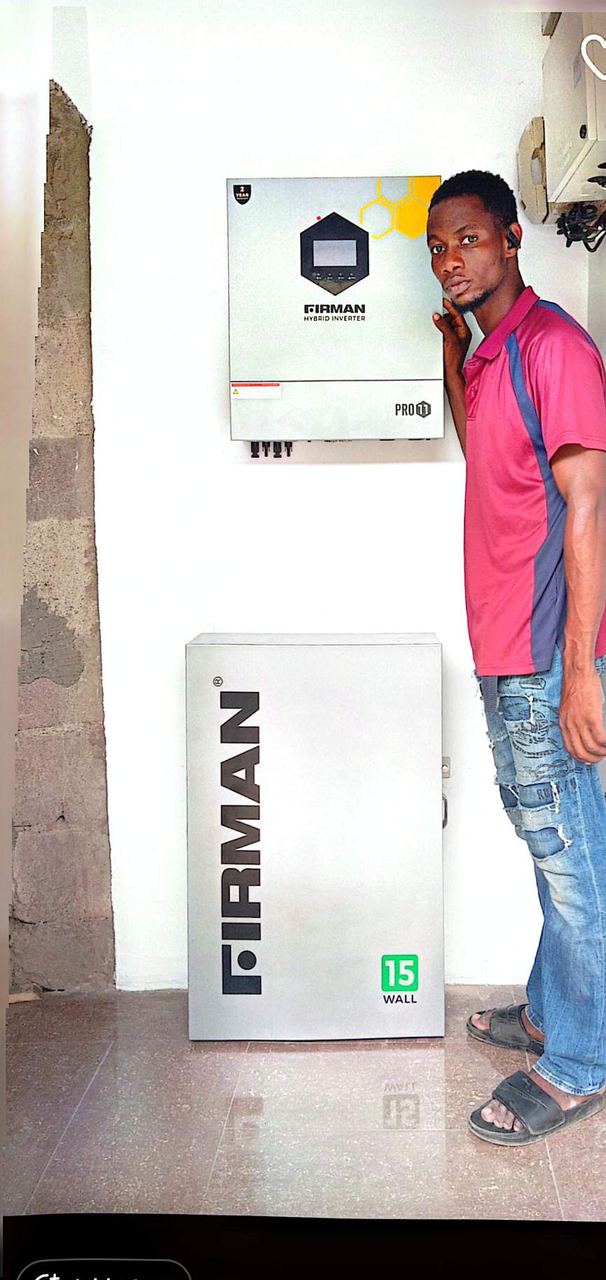 Team member beside a finished inverter installation